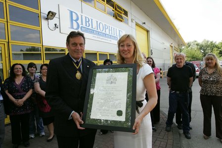 Bob Hall, President of the Royal Warrant Holders' Association presents us with our calligraphy on parchment Royal Warrant 2011. / {Location}: Datapoint\\n\\n22/05/2012 11:49